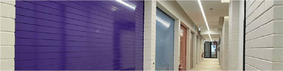 Ezi-roll coloured commercial roller doors inside school stadium 